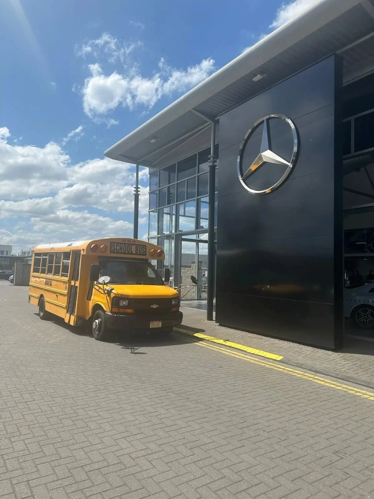 Burger Bus catering a corporate event at a car showroom